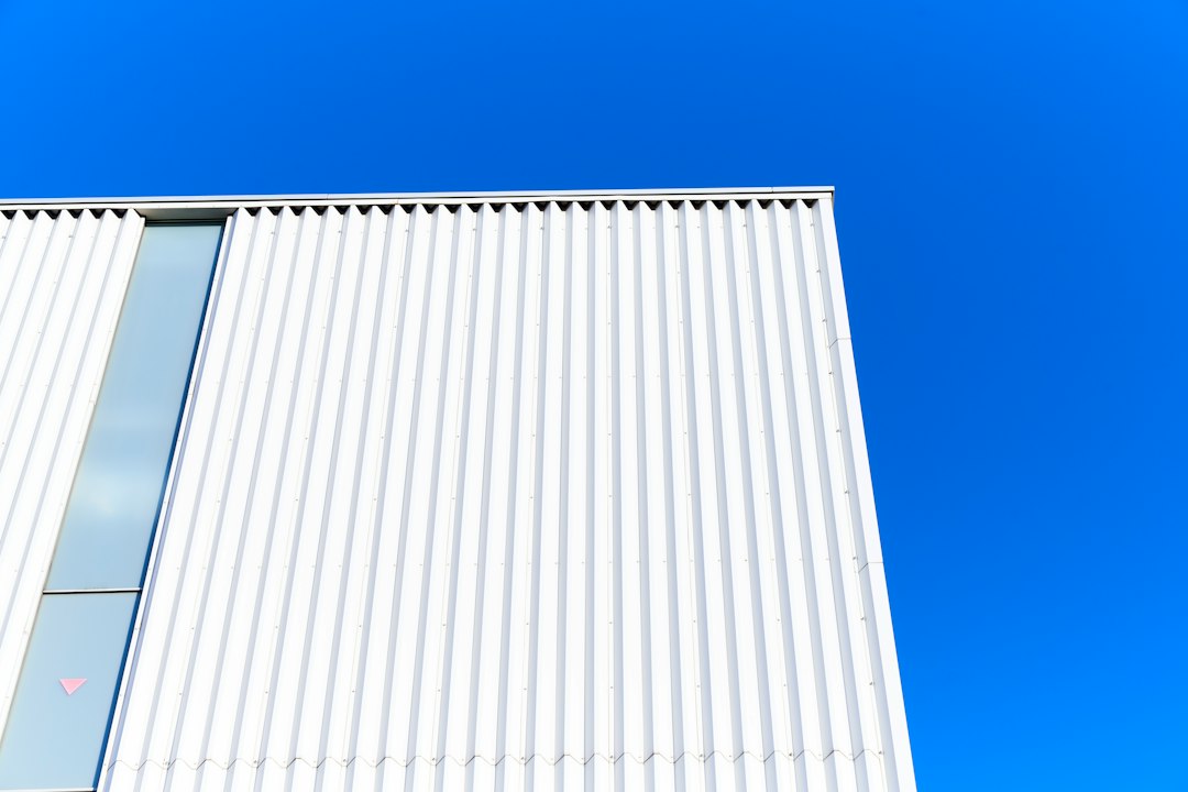 An abstract, professional photograph of bright, modern architectural lines against a clear sky, symbolizing a future-proofed and well-designed business strategy.